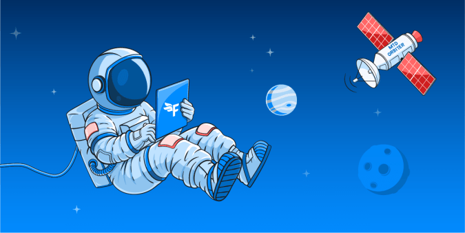 An astronaut in space looking at a laptop